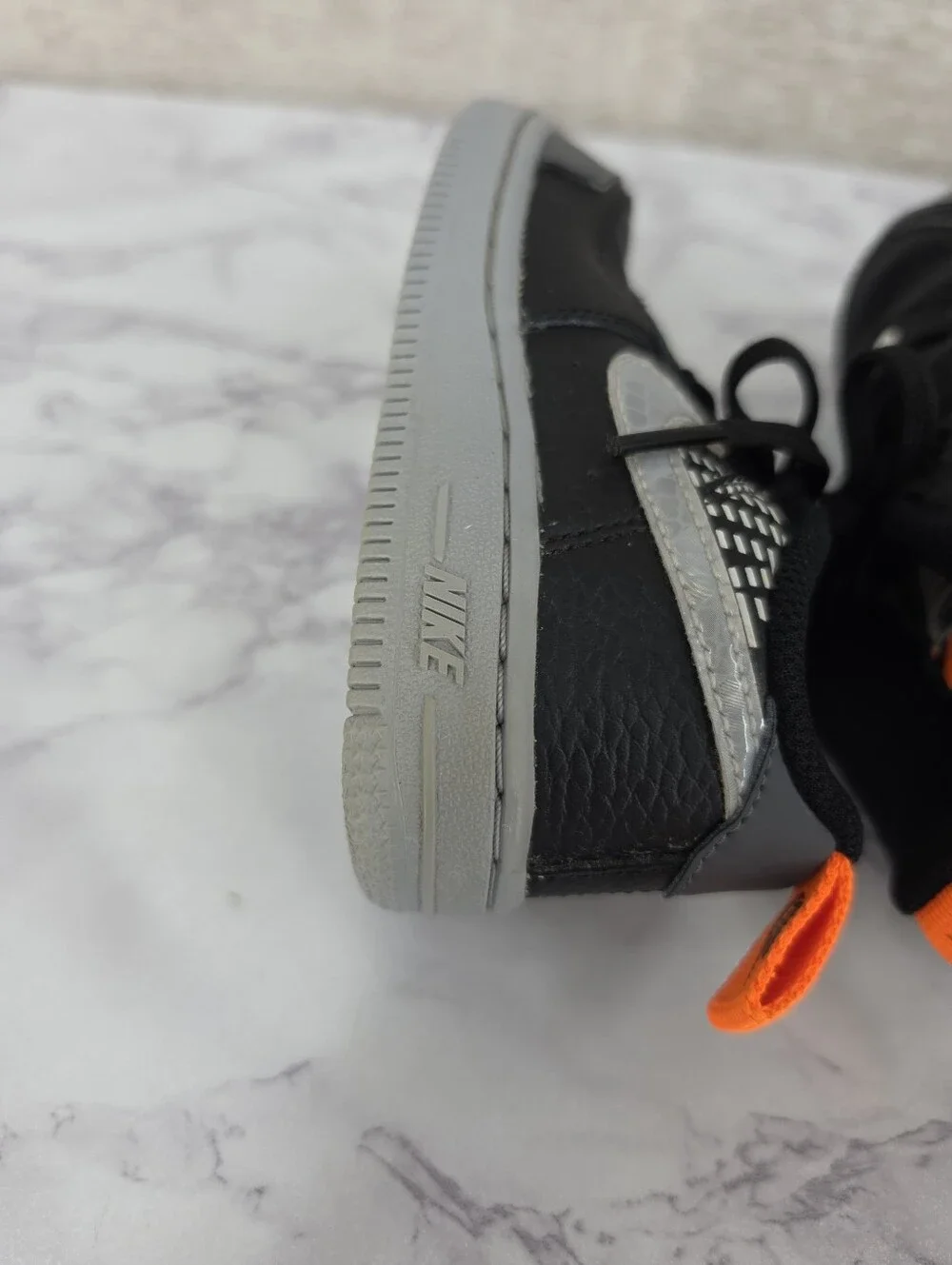 Nike Air Force Lv8 Kids Black & Gray Low-Top Sneakers with Orange Accent